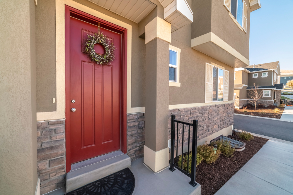 Colourful,Red,Entrance,Door,With,Wreath,Near,Sunset